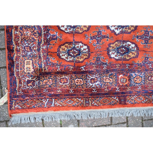 74 - Bokhara carpet in cashmere and silk. Traditional elephants foot pattern with stylised floral boarder... 