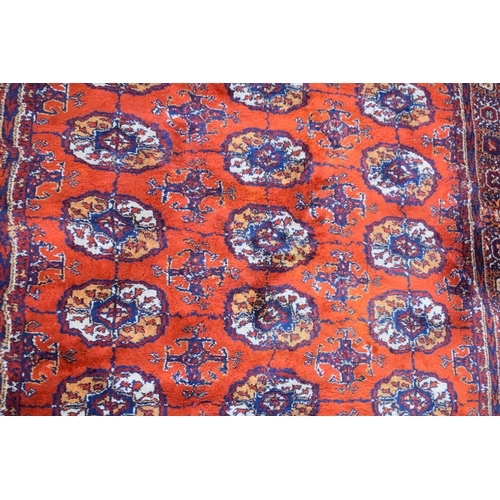 74 - Bokhara carpet in cashmere and silk. Traditional elephants foot pattern with stylised floral boarder... 