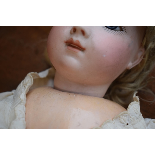 154 - Bisque head antique doll, possibly Bru or Jumeau, no markings apparent. Blue glass eyes with composi... 