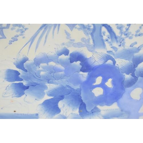 213 - Late 19th century large Japanese charger with foliage design, blue tones, 46cm wide (restored).
