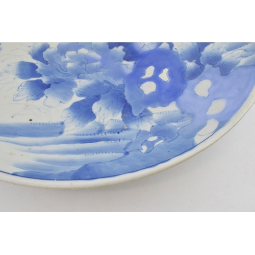 213 - Late 19th century large Japanese charger with foliage design, blue tones, 46cm wide (restored).