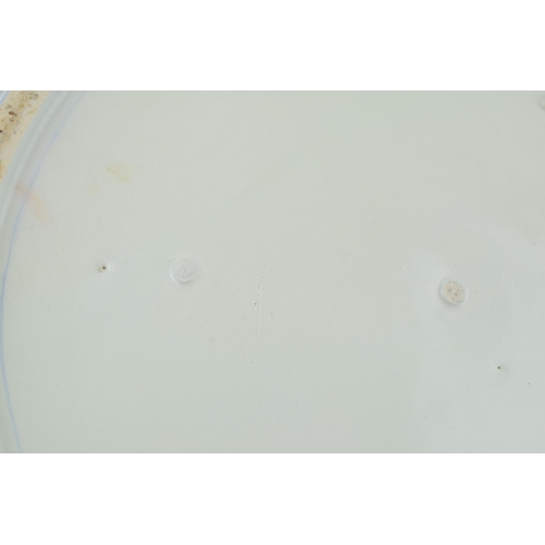 213 - Late 19th century large Japanese charger with foliage design, blue tones, 46cm wide (restored).