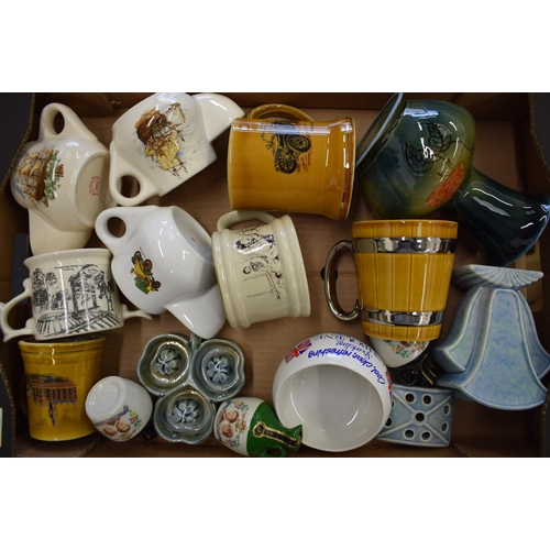 87 - A collection of Wade to include advertising wares such as Ashbourne Mineral Water, shaving mugs, a f... 