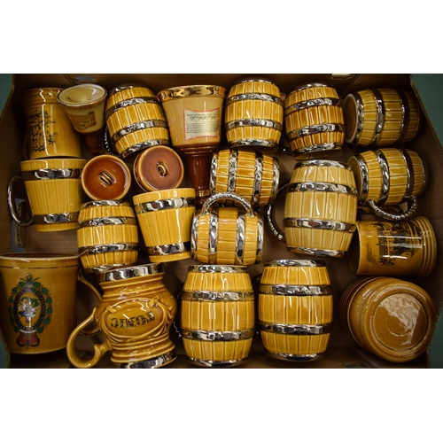 88 - A good collection of Wade tankards in the form of beer barrels and others (Qty).