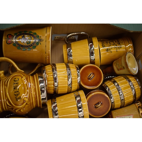 88 - A good collection of Wade tankards in the form of beer barrels and others (Qty).