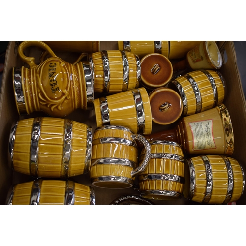 88 - A good collection of Wade tankards in the form of beer barrels and others (Qty).