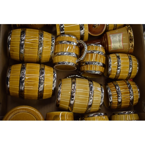 88 - A good collection of Wade tankards in the form of beer barrels and others (Qty).