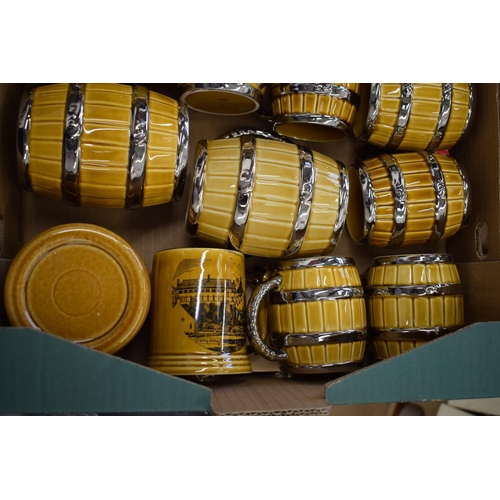 88 - A good collection of Wade tankards in the form of beer barrels and others (Qty).
