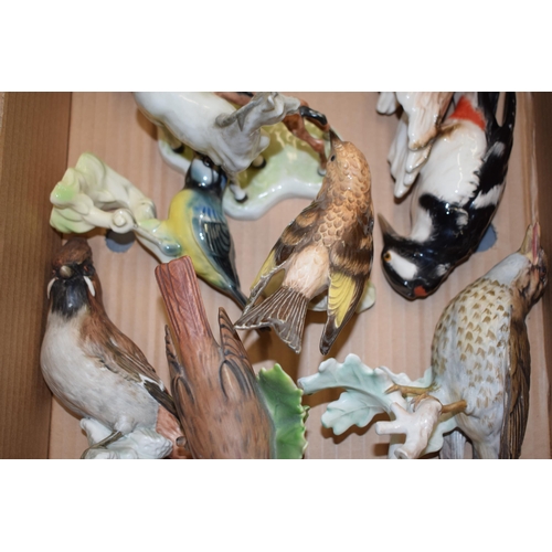 17 - A good collection of Goebel ceramics to include a horse and foal, a bluetit, woodpeckers and others ... 