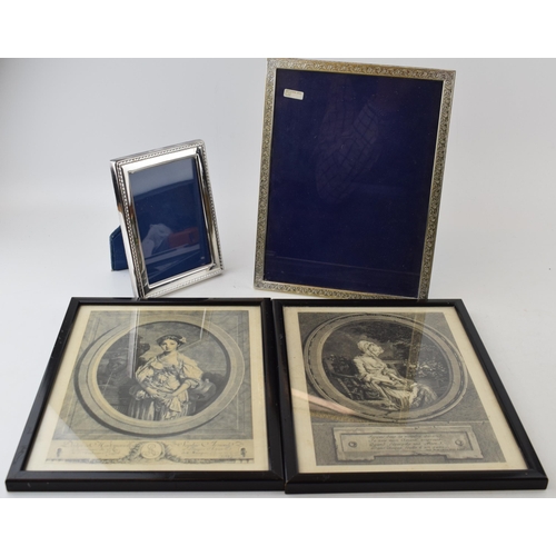 231 - A pair of silver plated photo frames, tallest 26cm tall, with a pair of French fashion prints / engr... 