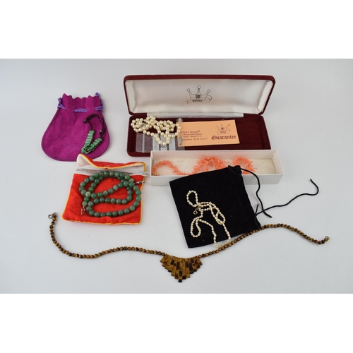 187 - A collection of jewellery items to include freshwater pearls, Jersey pearls, coral necklace, jade ne... 