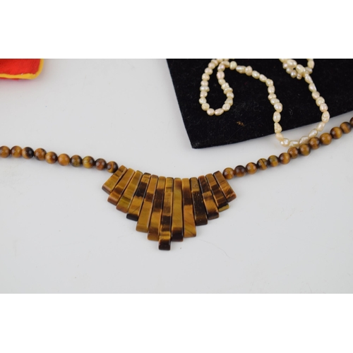 187 - A collection of jewellery items to include freshwater pearls, Jersey pearls, coral necklace, jade ne... 