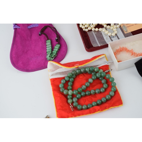 187 - A collection of jewellery items to include freshwater pearls, Jersey pearls, coral necklace, jade ne... 