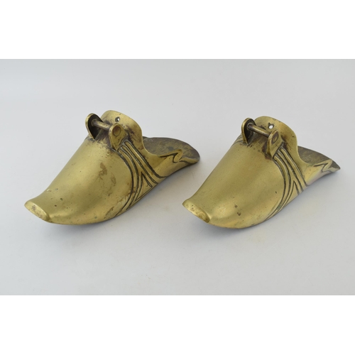 198 - A pair of chinese style brass stirrups. Length 29cm, height 12cm.