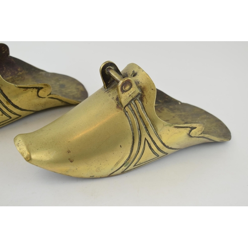 198 - A pair of chinese style brass stirrups. Length 29cm, height 12cm.