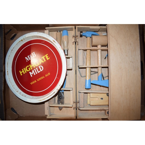 181 - A mixed collection of items to include a vintage childrens woodworking set together with three pub t... 