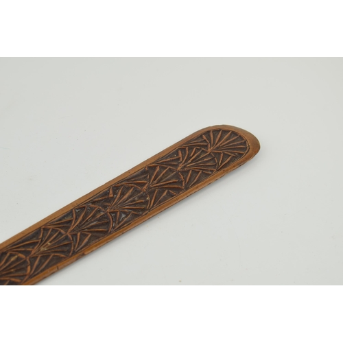 184 - A hand-carved page turner with hand painted crest to obverse and letter 'B' inscribed. Length 44cm.