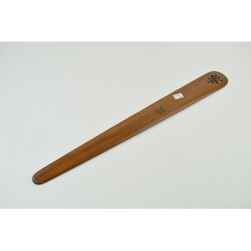 184 - A hand-carved page turner with hand painted crest to obverse and letter 'B' inscribed. Length 44cm.