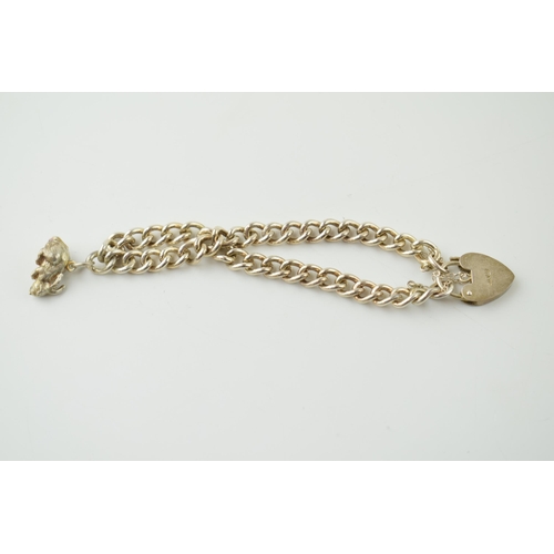190 - A silver bracelet with heart shaped clasp and rabbit charm, 20.0 grams.