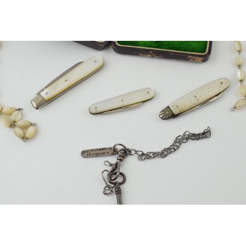 194 - Two silver fruit knives and a stainless steel fruit knife with mother of pearl handles. Two pieces o... 
