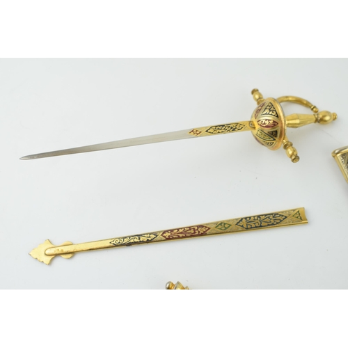 203 - A pair of novelty letter openers in the form of swords and daggers, 22cm longest (2).