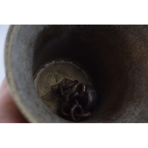 208 - Brass bell with government Cross-foot / Broad arrow mark to inside. Original wooden handle and dinge... 