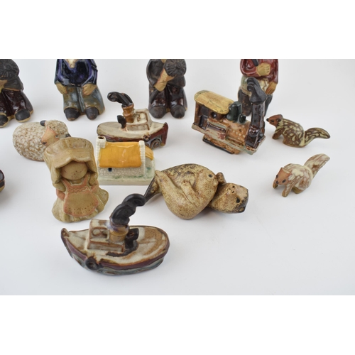 21 - A good collection of mostly Tremar studio pottery to include figures, a train, a car, animals and ot... 