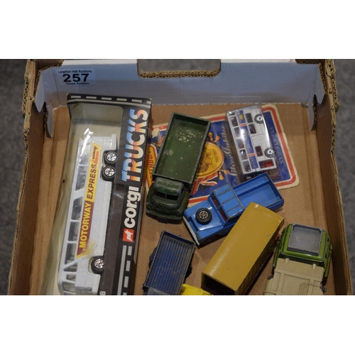 257 - A collection of vintage toys to include boxed and unboxed examples by Dinky, Corgi and similar manuf... 