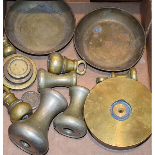 261 - A collection of brass weights, scale pans and the base of a trench art shell, RW297 RLB 1980. (Qty)