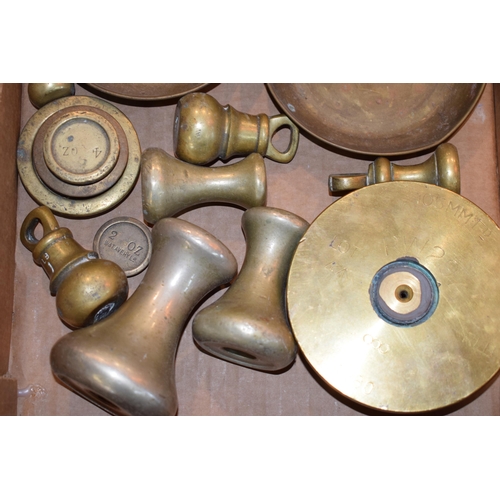 261 - A collection of brass weights, scale pans and the base of a trench art shell, RW297 RLB 1980. (Qty)