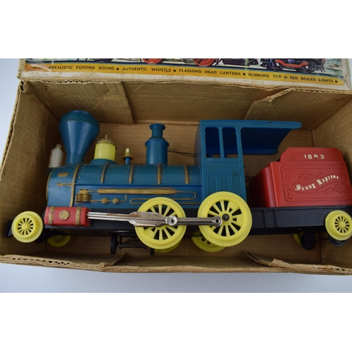 264 - A boxed vintage Locomotive '1883' Sunny Express battery operated toy train. Length 40cm.