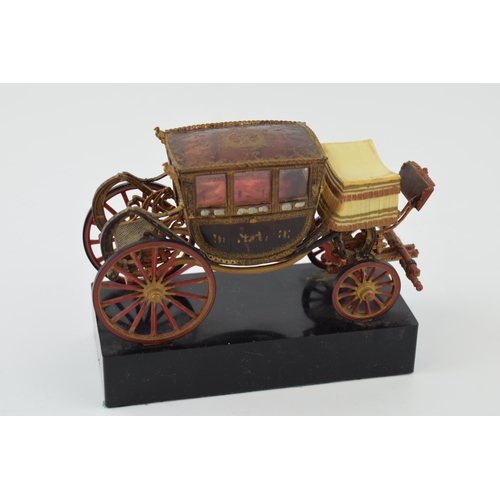 266 - Vintage model of a stage coach on plinth, in early plastic. Mae in Spain. Height 10cm.