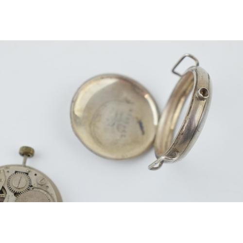 275 - A military style trench watch movement and outer case with inscribed date 1915. Case diameter 35mm.