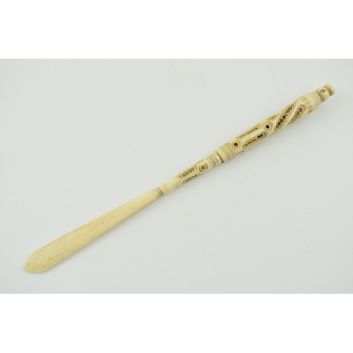 283 - A bone stanhope with integrated letter opener and pen. Length 23cm