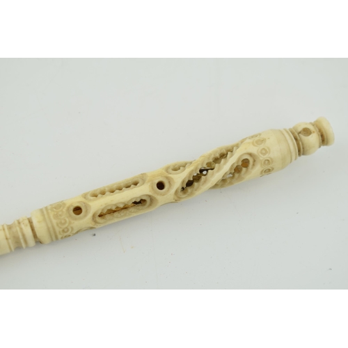 283 - A bone stanhope with integrated letter opener and pen. Length 23cm