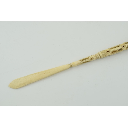 283 - A bone stanhope with integrated letter opener and pen. Length 23cm