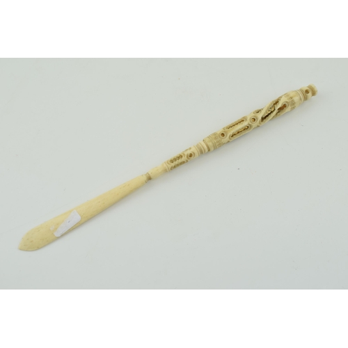 283 - A bone stanhope with integrated letter opener and pen. Length 23cm