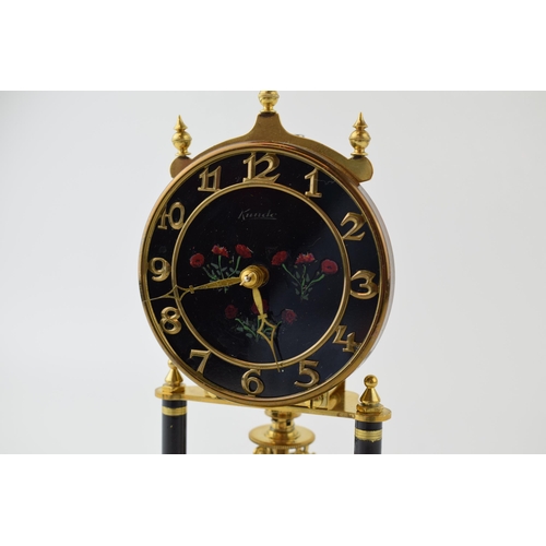 290 - An Anniversary clock by Kundo, Made in West Germany, brass base with hand-painted floral decoration ... 