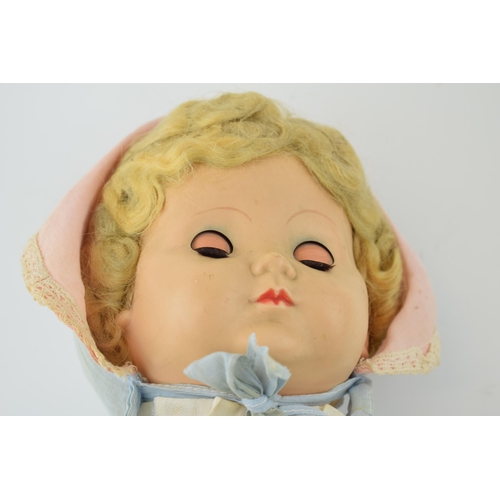 291 - Vintage Palitoy doll, Made in England c1950s. Moving eyes and period clothing. Height 51cm.