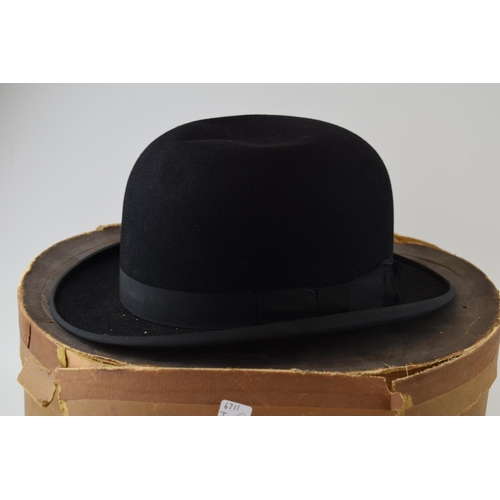 295 - Two vintage hats to include a Bowler hat by Tyrers Ltd and a Fedora in an original hat box by Woolis... 