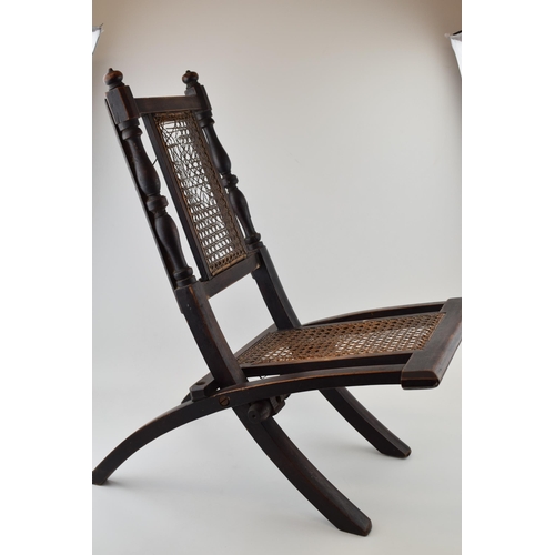 297 - Early 20th century child's folding chair, with rattan seat.