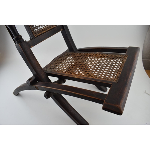 297 - Early 20th century child's folding chair, with rattan seat.