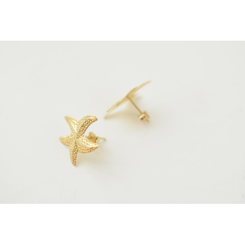 299 - A pair of 9ct gold earrings in the form of starfish, 0.4 grams.