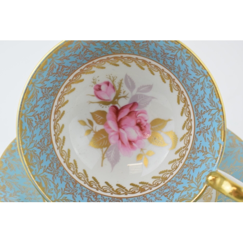 3 - An Aynsley cup and saucer with gilt highlights, hand-painted cabbage pink rose design. Height 7cm.