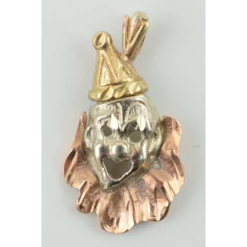 305 - 9ct gold pendant in the form of a clowns face, multi coloured, 1.8 grams, 28mm.