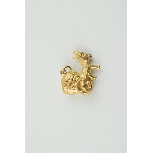 306 - 9ct gold charm in the form of a donkey pulling a cart, 1.3 grams.