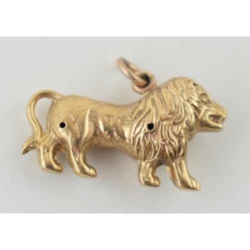 311 - 9ct gold charm in the form of a lion, 0.8 grams.