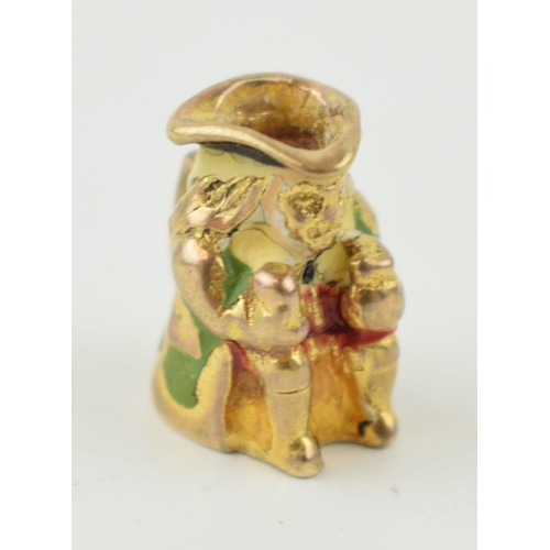 318 - 9ct gold charm in the form of a toby jug, 2.4 grams.