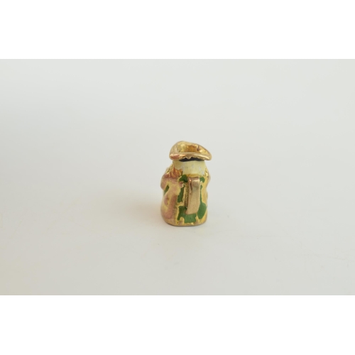 318 - 9ct gold charm in the form of a toby jug, 2.4 grams.