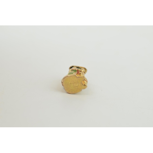 318 - 9ct gold charm in the form of a toby jug, 2.4 grams.